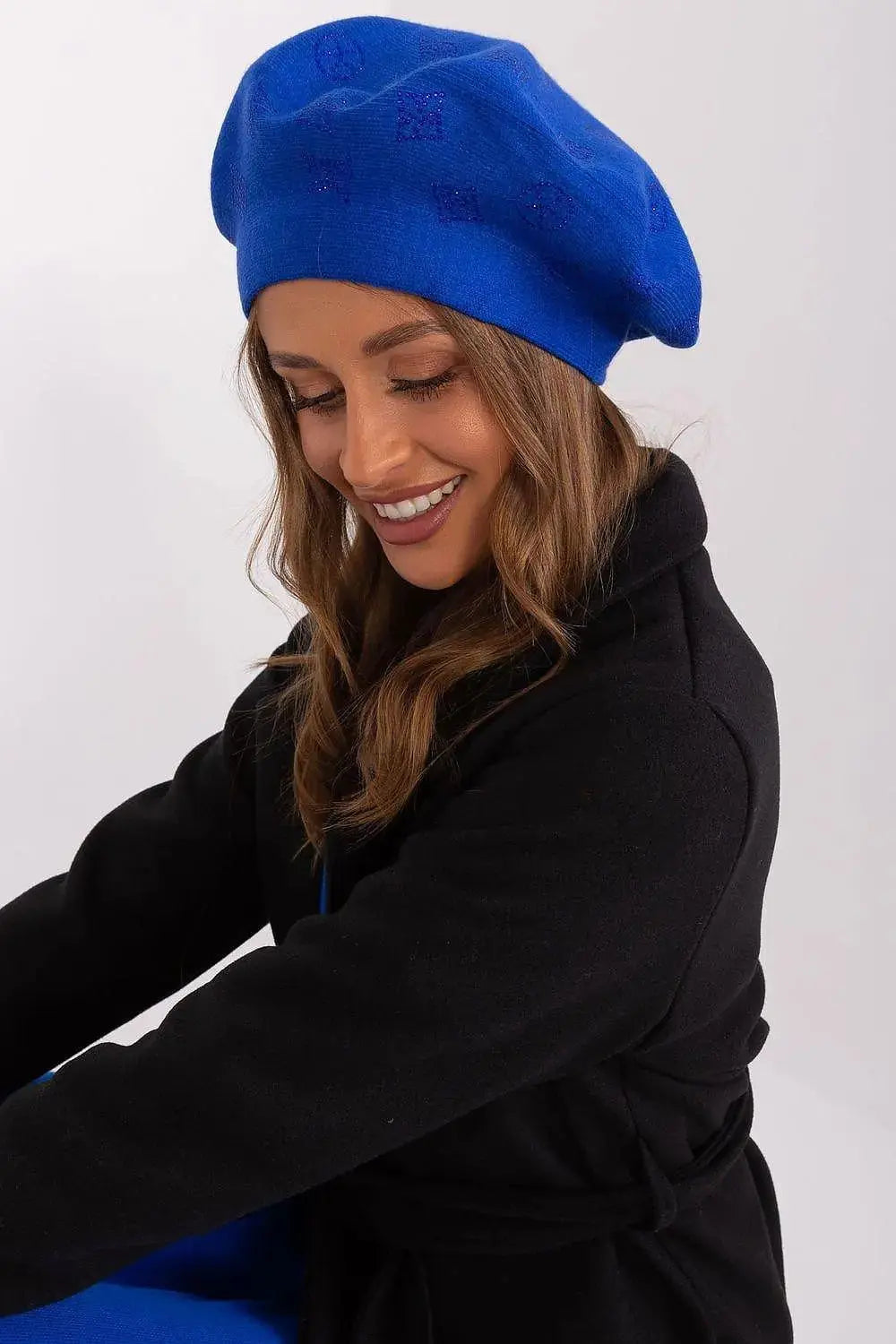 AT Knitted beret with interesting rhinestone application.