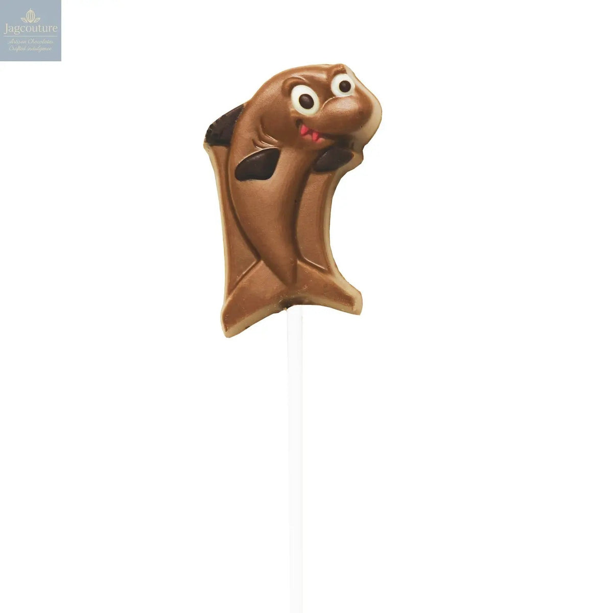 Hand decorated chocolate shark lollipops in display