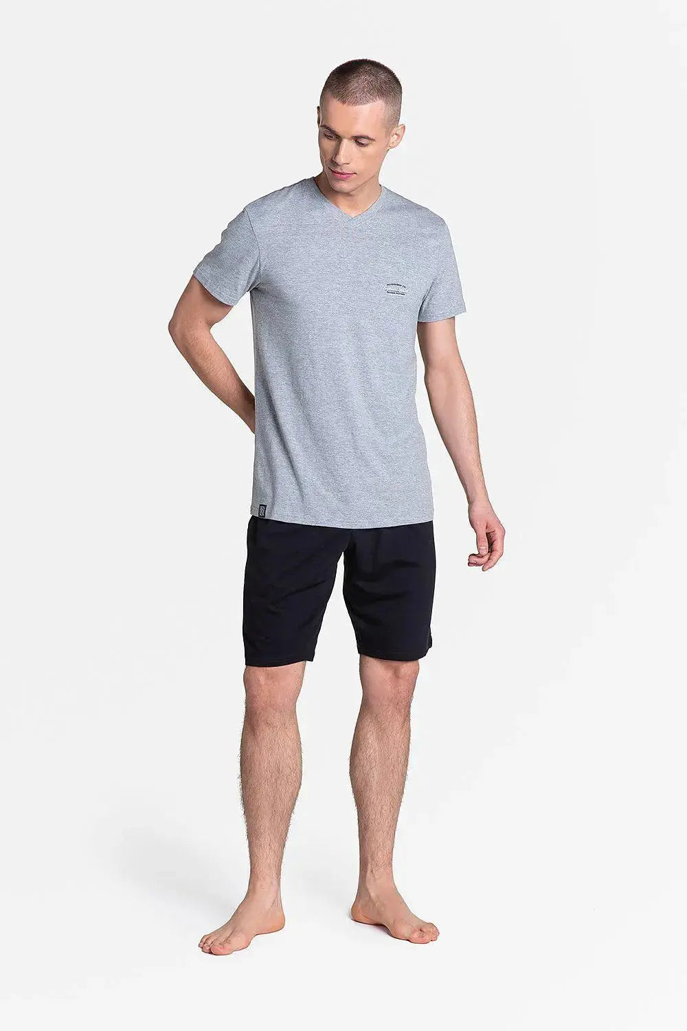 Henderson t-shirt and black trousers