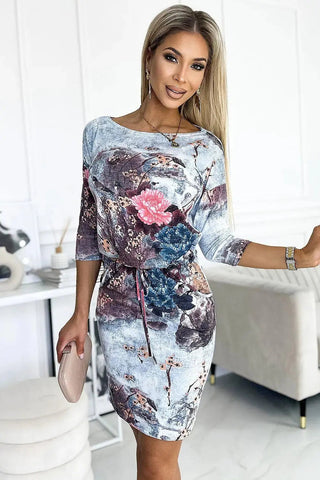 Numoco porty daydress with binding, 3/4 sleeves and pockets, flowers on a stone background