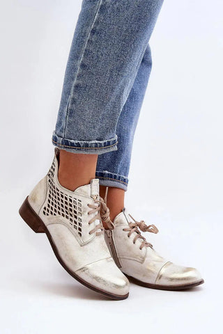 Step in style Women's natural suede boots with a low, openwork.