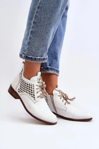 Step in style Women's natural suede boots with a low, openwork.
