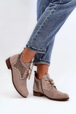 Step in style Women's natural suede boots with a low, openwork.