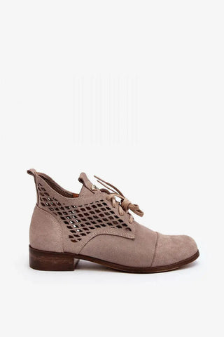 Step in style Women's natural suede boots with a low, openwork.